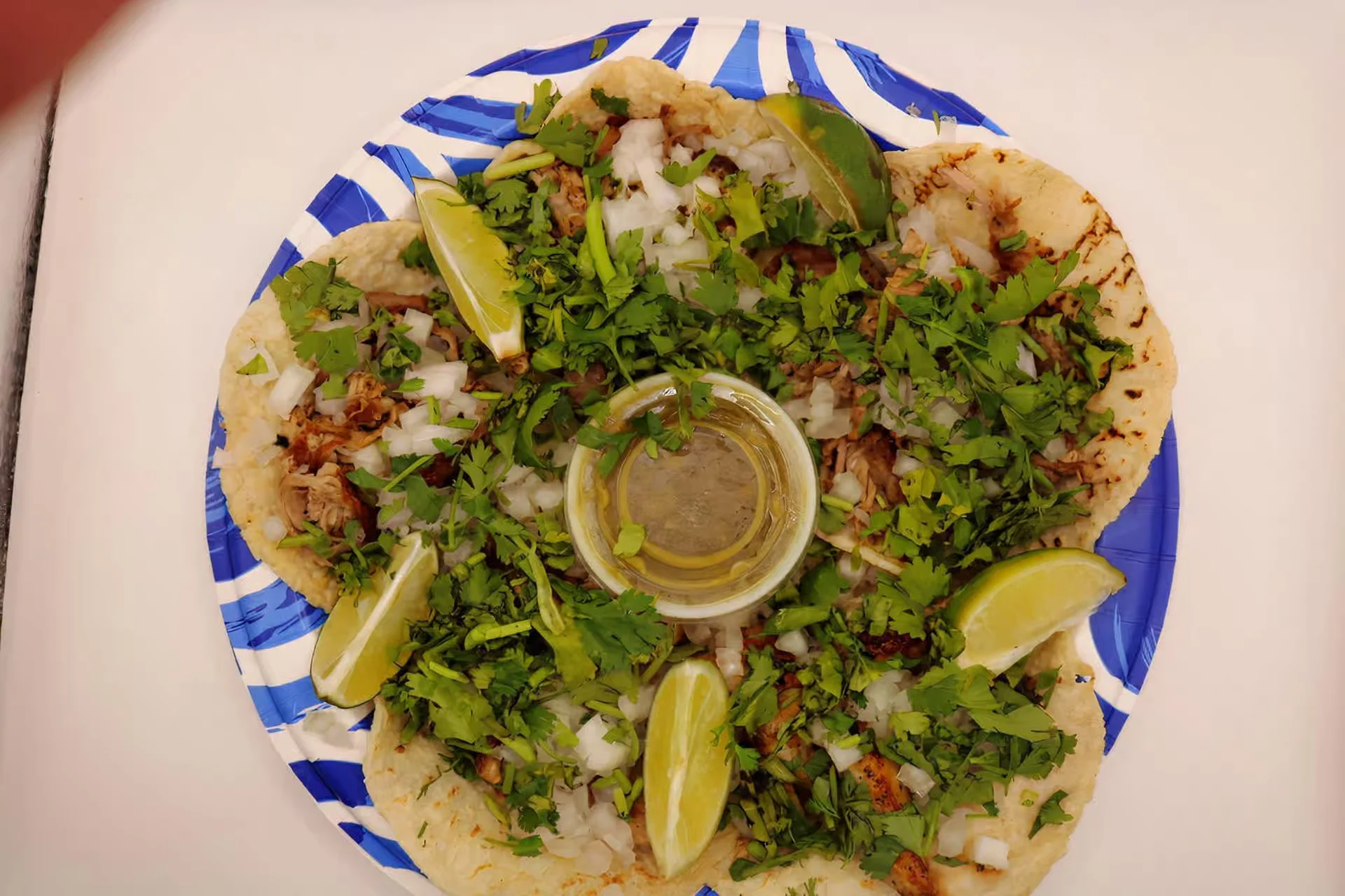 Street Tacos - Authentic street tacos with your choice of seasoned meat, fresh cilantro, onion, and house salsa on warm corn tortillas.